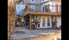 Custom sunroom six double french doors and cedar deck  with spiral staircase which overlooked beautiful lake.