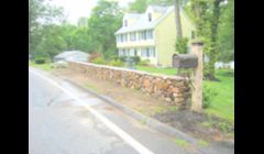 Stone wall w/ granite post