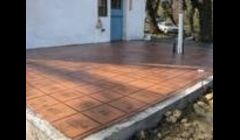 Room addition with heated stamped floor