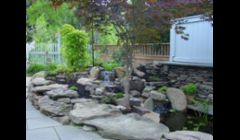Waterfall Pond repair replace with Under water Lighting by Acorn Landscaping of Rochester NY in Pittsford NY