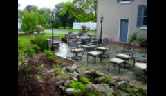 Bluestone/Slate Patio Replace/ Repair with Pondless Waterfall, Landscape Lighting and Plantings in Brighton NY by Acorn Landscaping of Rochester NY