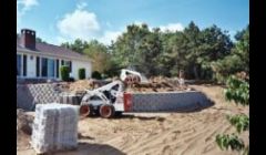 Bobcat Construction Services: bobcat raking, grading, clearing, brush mowing, loam spread, lawn installations.