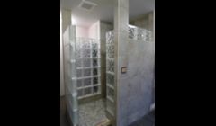 Central Contracting Inc. custom designed this elegant bathroom in Ladue, located in the county of St. Louis,  MO,  with the owner. This full tile walk-in shower incorporates unusual sized glass block and hand crafted tile bull nose for the corners. 
