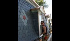Central Contracting Inc's foreman Joe installed a rose pattern to this new slate roof we installed. in St. Louis, Mo city. Notice the copper drip edge detail above his head. 