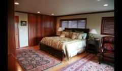 Here's a master bedroom to be proud of.  20 feet of floor to ceiling built in quarter sawn Sapele cabinets that we built in our shop. 