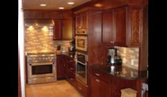 Cherry cabinetry, Tan Brown granite and commercial grade appliances make this kitchen's  owner very proud.