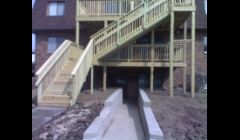 New deck and retaining wall added to 6 plex