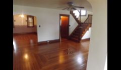 Rustic white oak floors installed in a bow tie border with a nautical star floor medallion