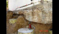 Foundation Repair on Mill Peak in San Diego.  Foundation settled by 6 inches on 40 feet of fill soil over 50 years.  You see the caisson/ pipe piling combination with house lifted up by 6 inches to correct foundation loss.