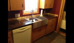 Solid concrete counter tops, a light black acid wash gives them a unique vintage modern appeal.