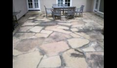 Flagstone patio before cleaning.