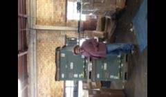 Mike posing by packaged units