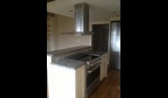 Island Stove Installation with Reciprocating Vent Hood in Boston