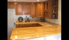 Beautiful bar area in Cherry wood cabinets and bar top!