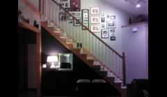 Accent wall deep gray purple with entryway floating shelf