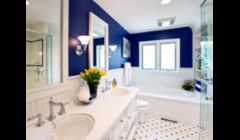bathroom in blue: twin vanity sinks, ceramic tile floor, glass shower, jacuzzi tub