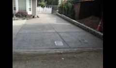 exposed driveway with concrete wall