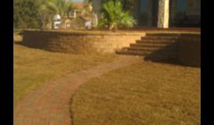 Landscape Concrete Retaining Wall with Paver Walkway