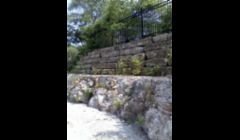 Natural Stone Retaining Wall with Decorative Iron Fence