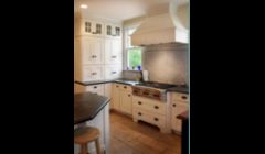 Montpelier, VA kitchen addition - Farmhouse kitchen in a shaker style with Wolf range front, glass cabinets and appliance garages