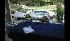 Outdoor massage next to the hot tub and koi ponds.