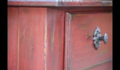 Distressed red hutch.  Custom color in Chalk Paint.