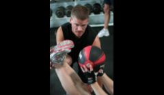 Medicine ball crunch and reach exercises for core strength and stability.