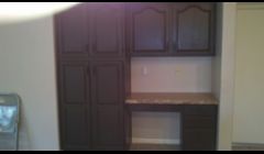 Refinished to a much more appealing chocolate color.