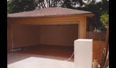 Garage after, plywood installed on rafters, attic stairway installed, sheetrock, texture and paint, cement stain on floor
