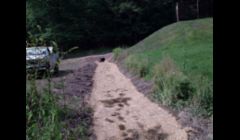 Restored drianage ditch that was full of sediment.  Pipe was removed cleaned of sedimentation clog and reinstalled. 