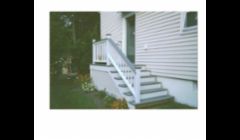 Constructed of low maintenance, rot resistant materials... this side entrance to a home in Dartmouth replaced a failing concrete set of stairs.
