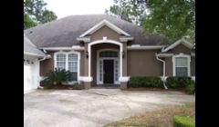 Exterior Painting Jacksonville Fl: This was a stucco home that we had to do a bit of stucco repair due to settling cracks. Afterwards painted a much darker color than previously.