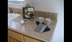 Small affordable kitchen with granite.