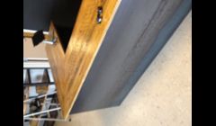 Custom counter top made form angle iron and 14 gauge sheets with a reclaimed wood top. Can be found at Social Wines in South Boston