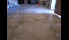 ceramic tile floor set in a subway pattern