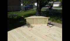 A 22' x 14' deck with two benches that open for storage.