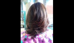 a soft brown hi lite on relaxed hair