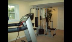 More of the new basement/family room. One side of the stairs is entertainment/bar area, other side is a home gym. 