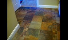 Ceramic tile floor w/inlays & many turns & cuts. 