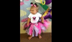 Minnie Mouse personalized onesie with matching ribbon accented tutu.  $27.00 plus $4.00 shipping.  Modeled by one of our adorable customers:)  Sizes 0-3T