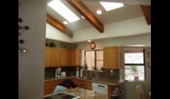 Custom sized skylights installed, original dropped ceiling was removed and whole ceiling was rebuilt and added six feet to the height.  All work done by The Skylight Specialist