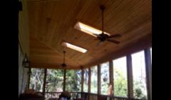 Rear porch with bead board ceiling.