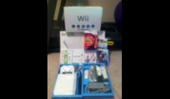 Wii Bundle  if Wii Console, Wii Fit,  4 Controllers, 5 games, Wii Fit balance Board all sold at auction for just below New retail market value,